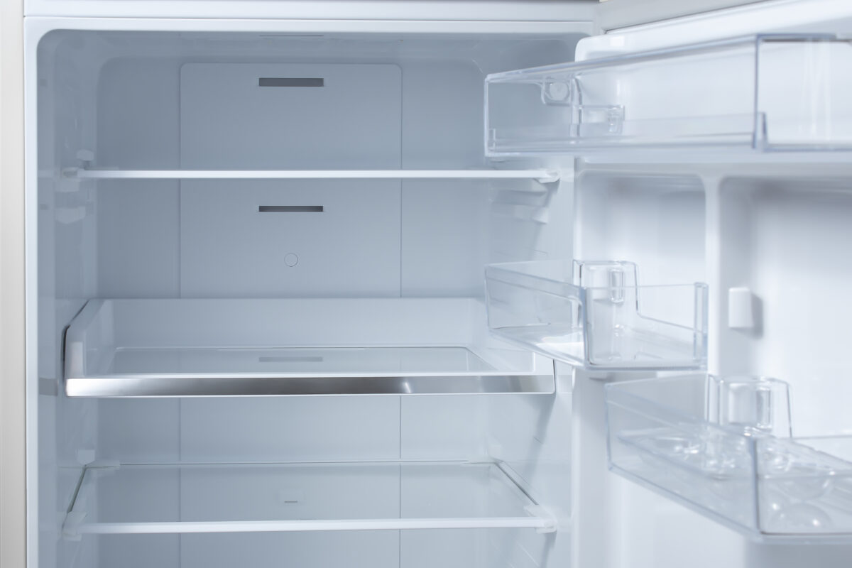 Opened empty refrigerator